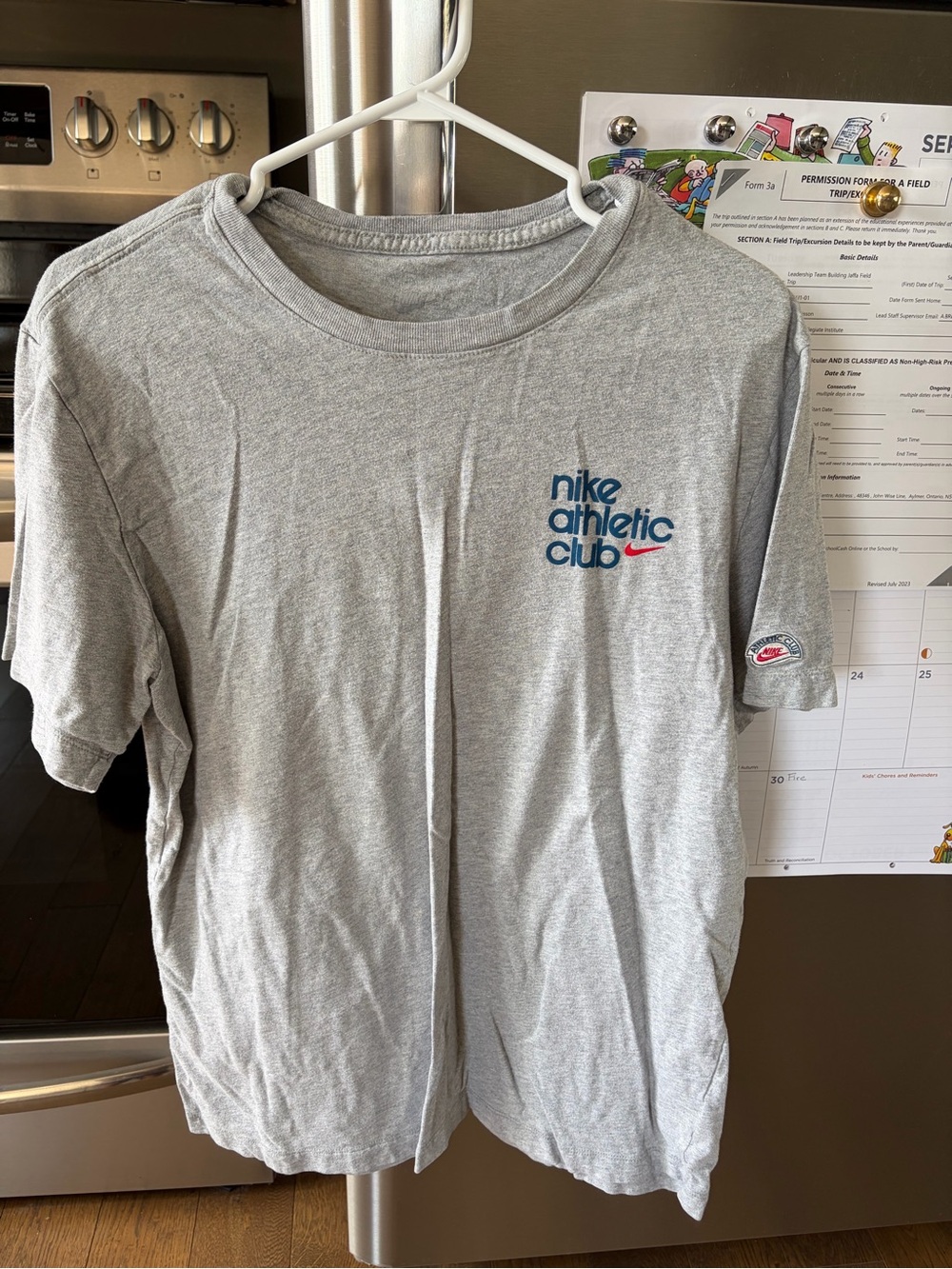 Nike Men’s Gray Athletic Club Tee with Blue Logo and Red Swoosh